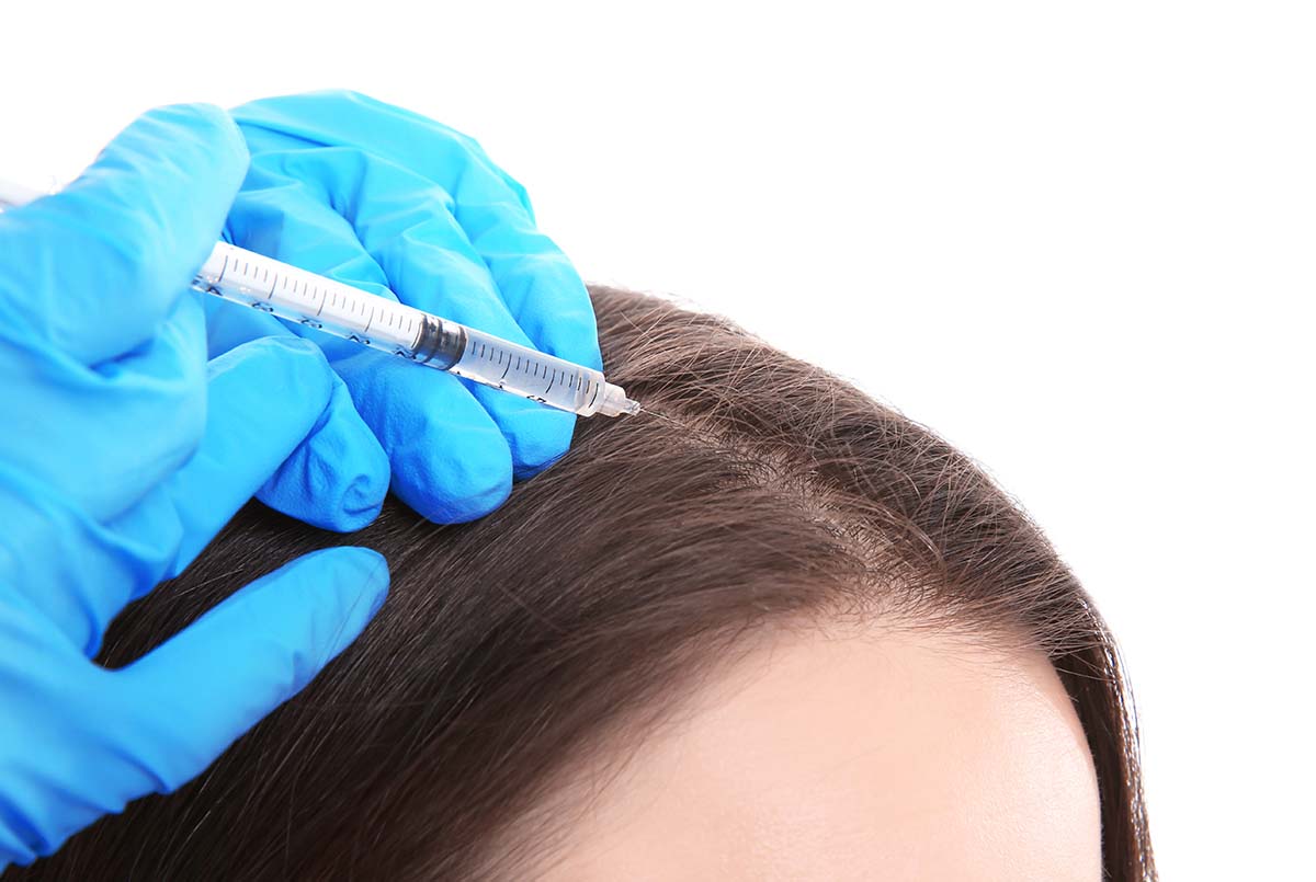 Young Woman With Hair Loss Problem Receiving Injection On White